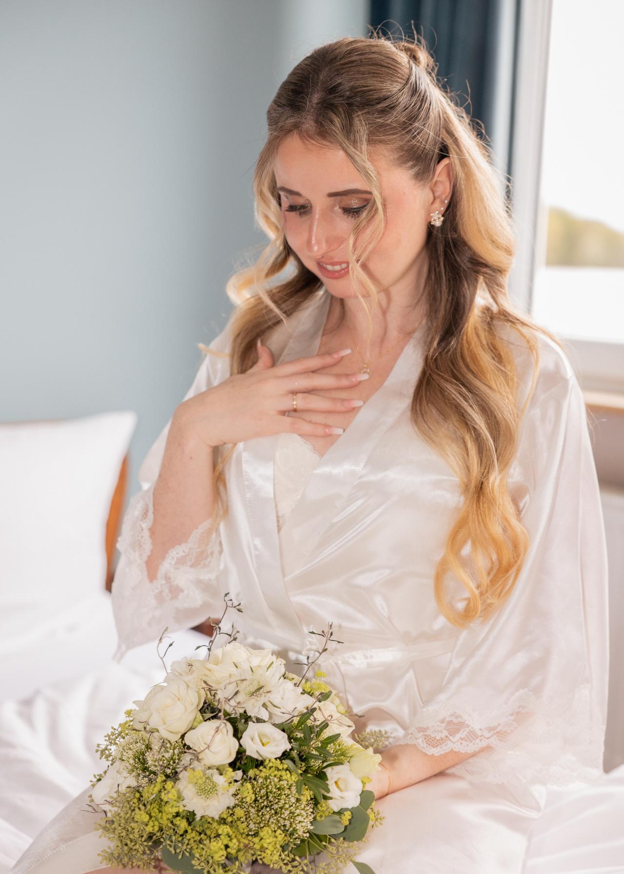 Bride holding her bouquet during a calm getting ready moment
