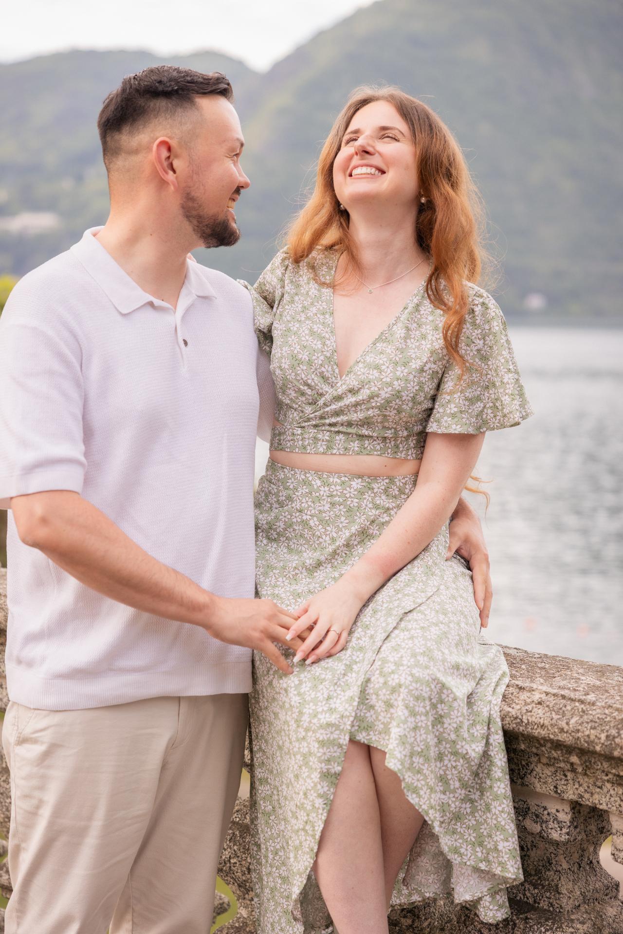Engaged couple sharing a moment by Lake Como