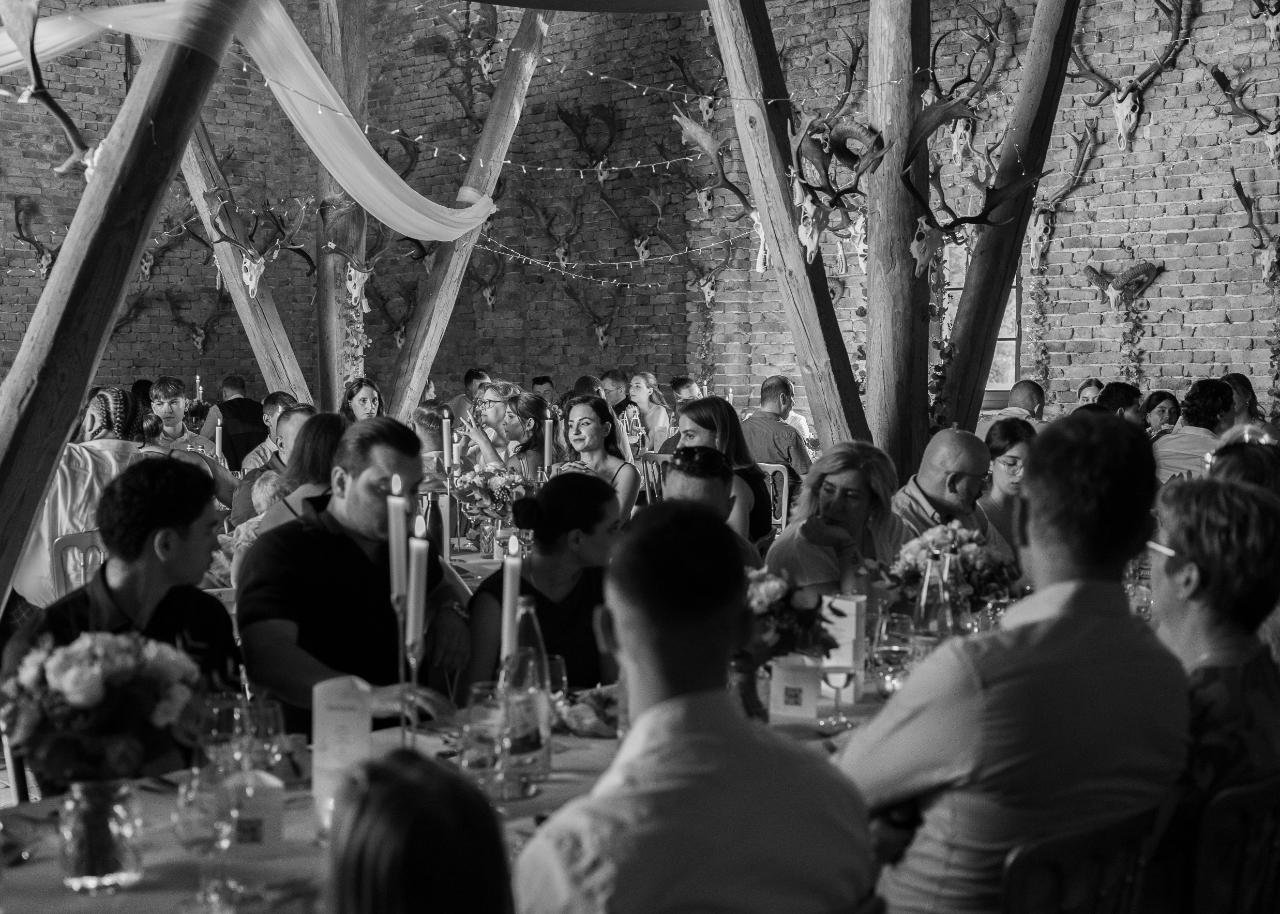 Wedding guests enjoying an intimate candlelit dinner