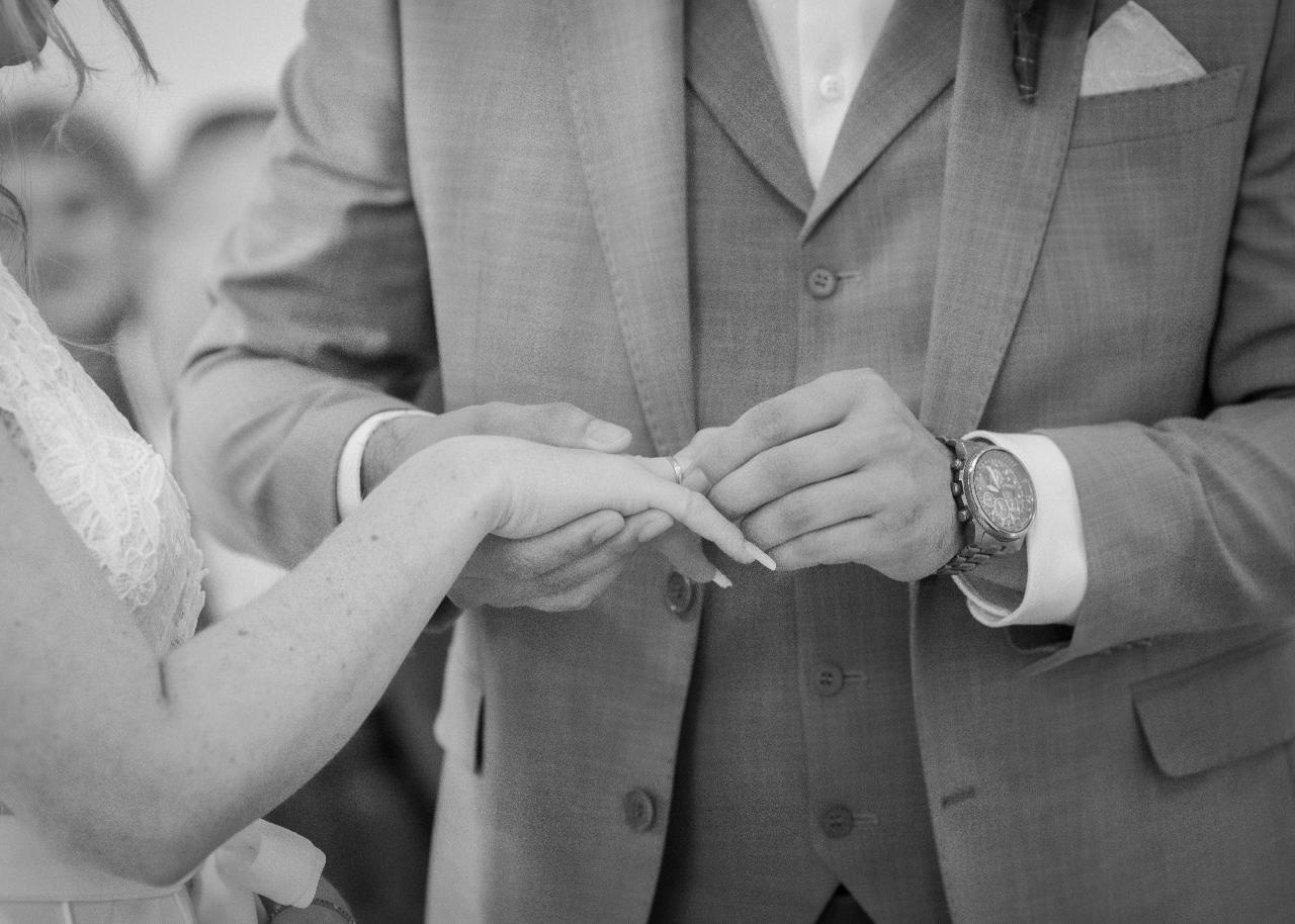 Close-up of the wedding ring exchange during the ceremony