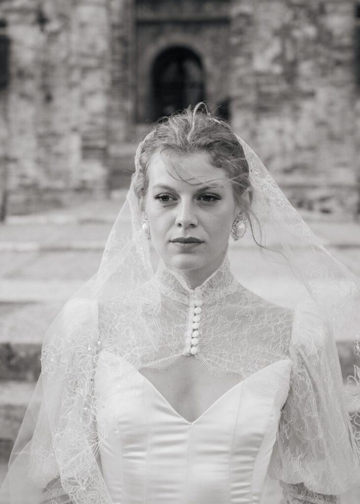 Black and white bridal portrait in a lace wedding dress at Castello di Celsa, Tuscany luxury wedding venue.