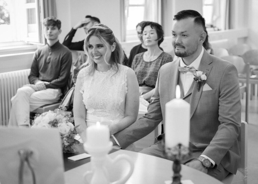 Bride and groom seated together during their civil wedding ceremony